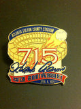 MLB HANK AARON 715 HOME RUNS COMMEMORATIVE LAPEL PIN, CIRCA 1999, FULTON COUNTY STADIUM